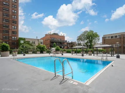 a view of a swimming pool and a chairs