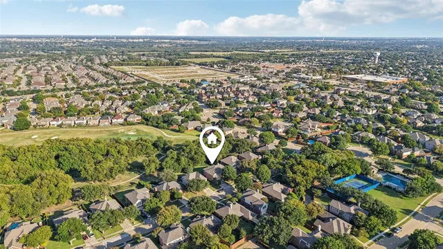 an aerial view of residential building with parking space