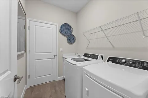 a bathroom with a toilet sink and a mirror