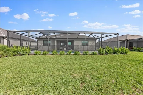 a front view of a building with a garden