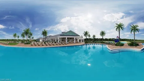 a front view of a house with fountain garden and swimming pool