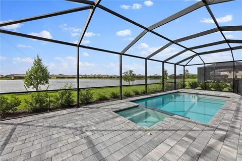 a view of a swimming pool with a yard