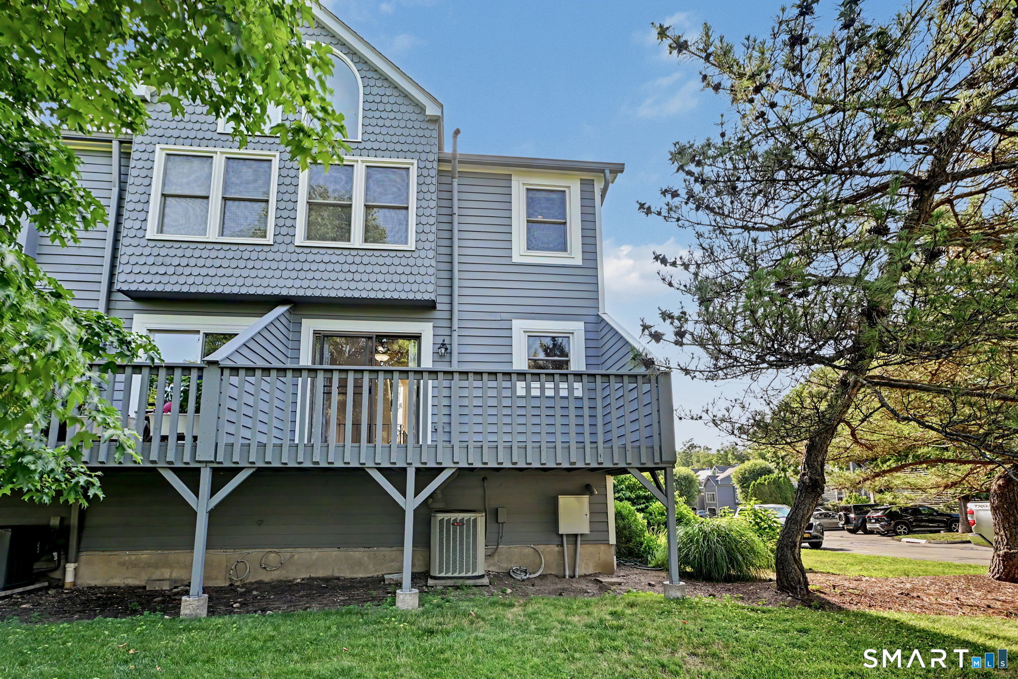 61 Fawn Ridge Lane, Unit 61 Wilton, CT 06897 - Photo 26 of 33 Rear view of the unit.
