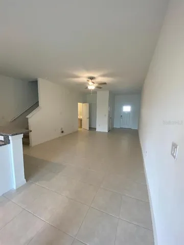 a view of a room with stairs and a window