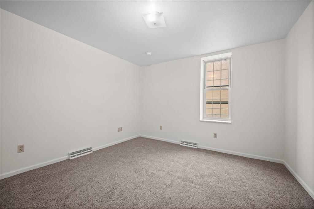 311 Catherine Street McKees Rocks, PA 15136 - Photo 15 of 41 an empty room with windows