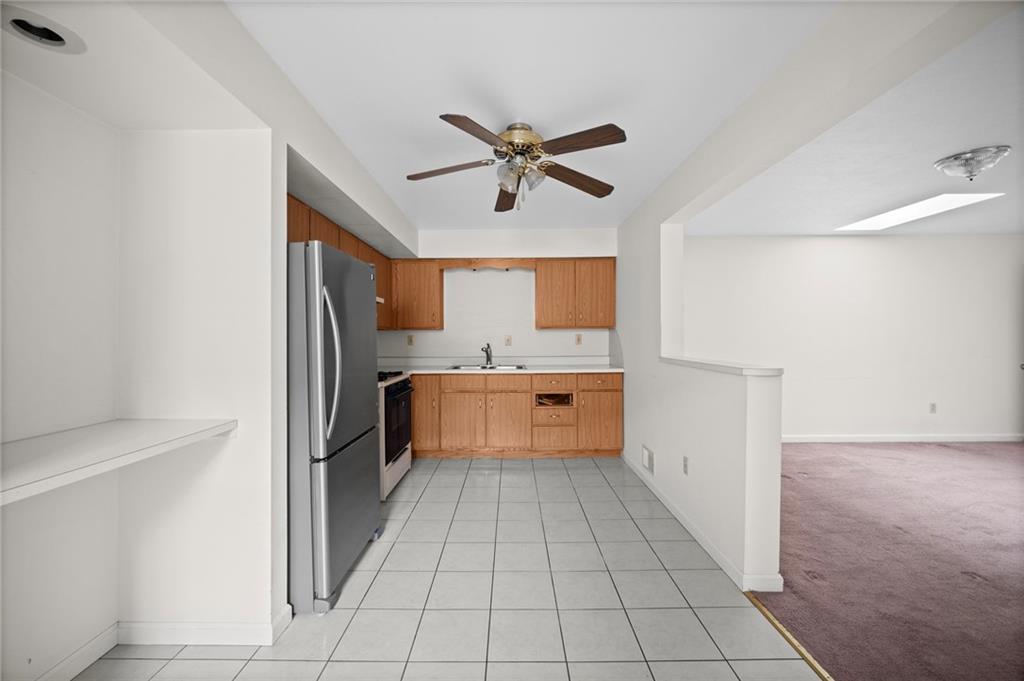 311 Catherine Street McKees Rocks, PA 15136 - Photo 20 of 41 a kitchen with a refrigerator a sink and dishwasher