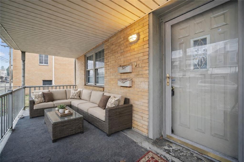 311 Catherine Street McKees Rocks, PA 15136 - Photo 2 of 41 a balcony with furniture and large window