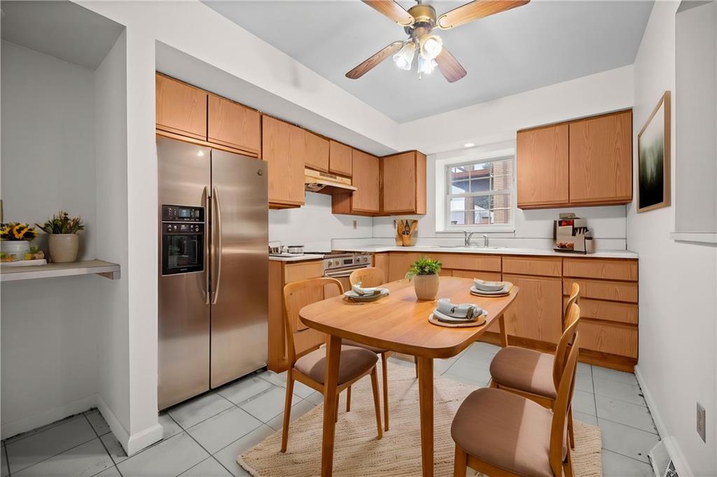 311 Catherine Street McKees Rocks, PA 15136 - Photo 3 of 41 a kitchen with a dining table and chairs