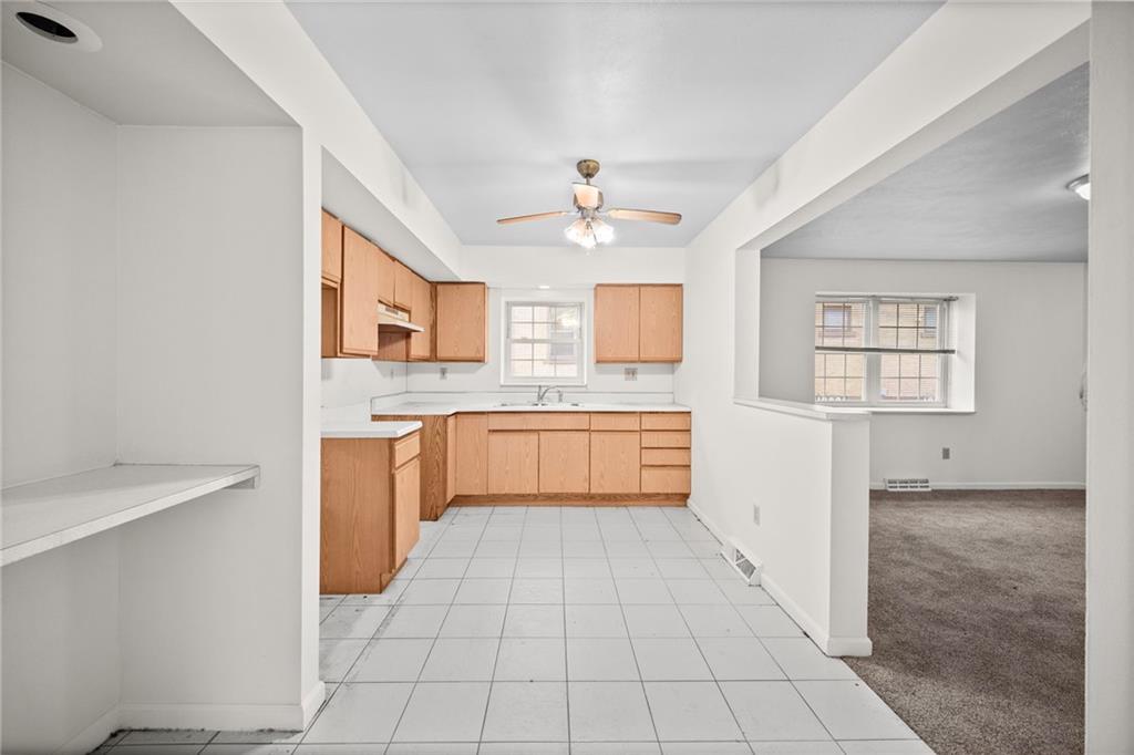 311 Catherine Street McKees Rocks, PA 15136 - Photo 4 of 41 a kitchen with a stove a sink and a refrigerator