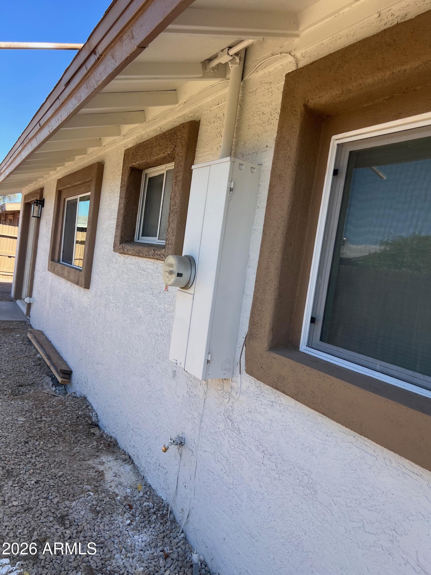 3818 West Ruth Avenue Phoenix, AZ 85051 - Photo 13 of 20 a view of a house with window