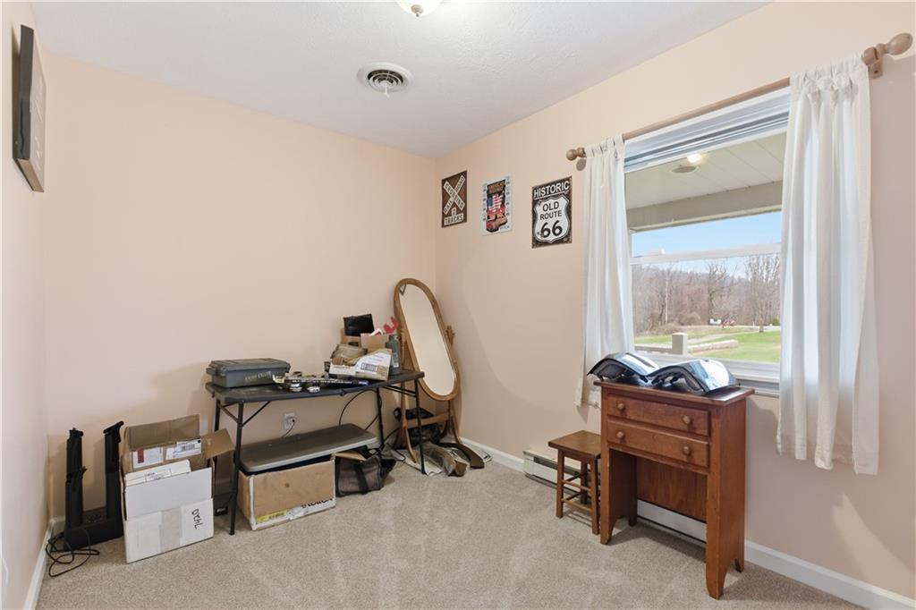 87 Broad Street Marianna, PA 15345 - Photo 13 of 37 a view of a workspace with furniture and a window