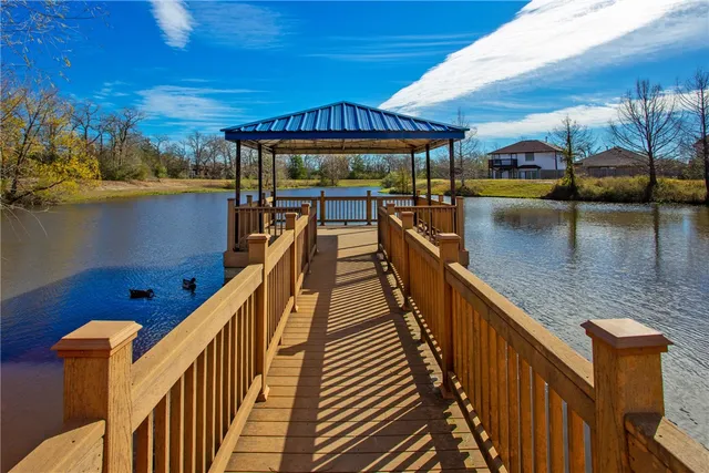 a view of a balcony with an outdoor seating