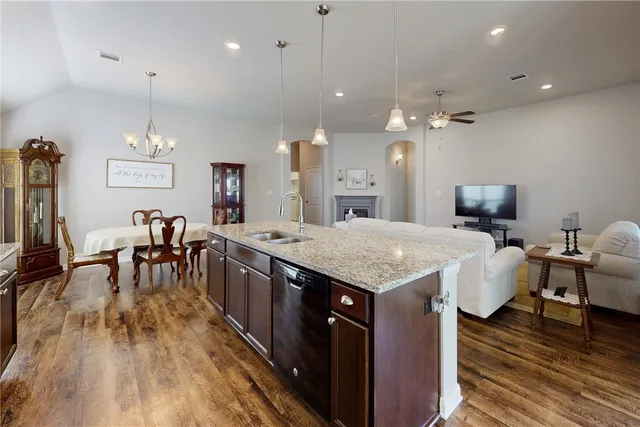 an open kitchen with a table and chairs in it