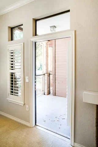 a view of walk in closet with clothes
