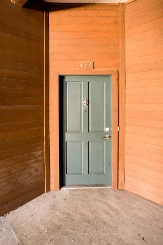 a view of a hallway to a bedroom