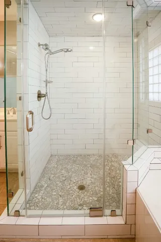 a spacious bathroom with a double vanity sink mirror and double