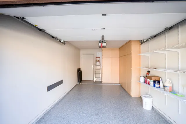 a view of street with flower plants and tree