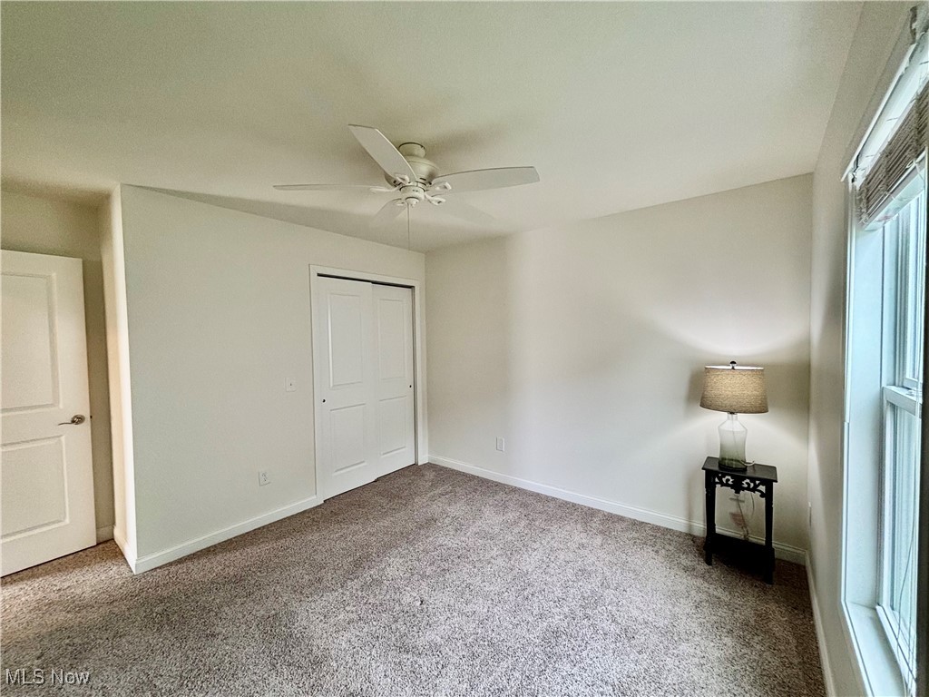 1132 Hummingbird Way Findlay, OH 45840 - Photo 12 of 28 Unfurnished bedroom featuring carpet flooring, ceiling fan, and a closet