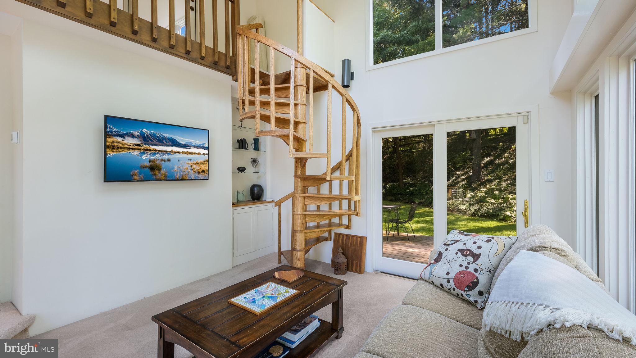 1099 Pebble Hill Road Furlong, PA 18925 - Photo 17 of 64 Light-filled Sunroom with Spiral Staircase