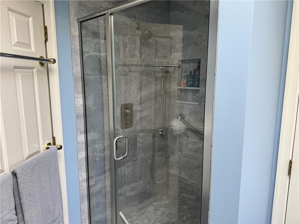 4114 Rochelle Drive Allentown, PA 18104 - Photo 29 of 35 A well-appointed shower stall features modern tilework and convenient built-in shelving.