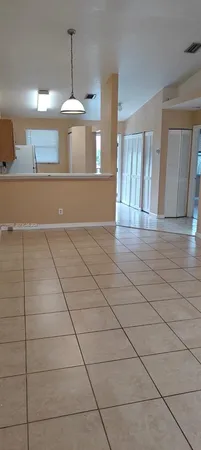 a view of a kitchen with a sink and cabinets