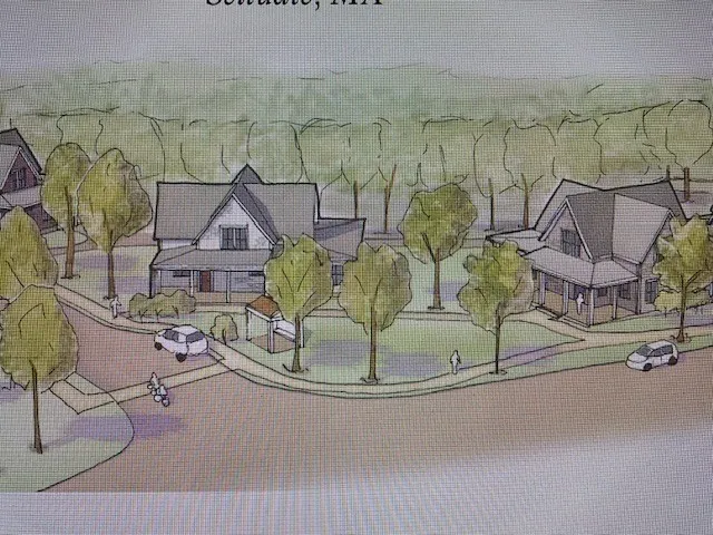 a view of front door with wooden floor