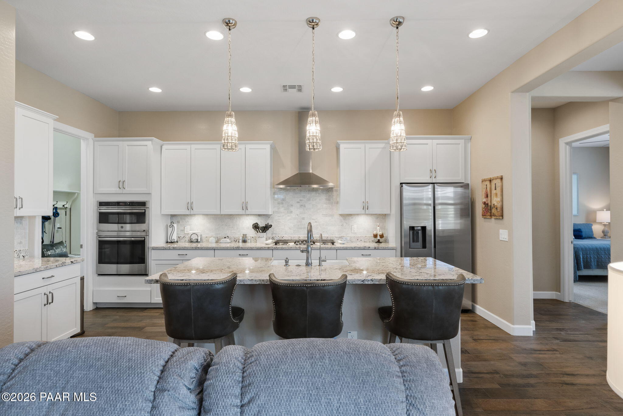2792 Brooks Range Prescott, AZ 86301 - Photo 17 of 35 a kitchen with stainless steel appliances kitchen island granite countertop a sink and a refrigerator
