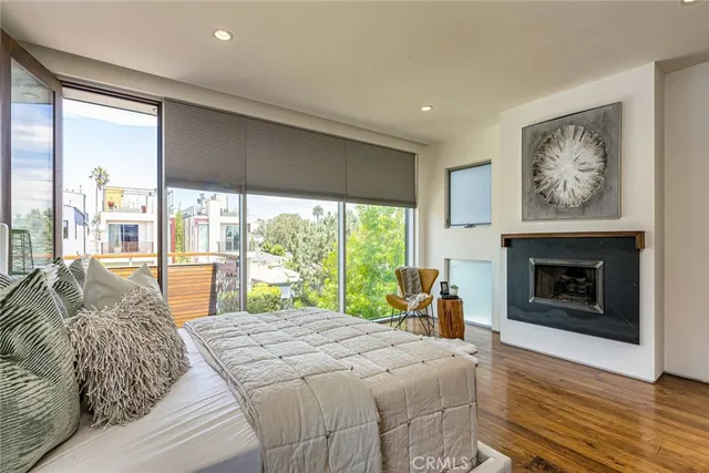 a bedroom with a bed and a fireplace