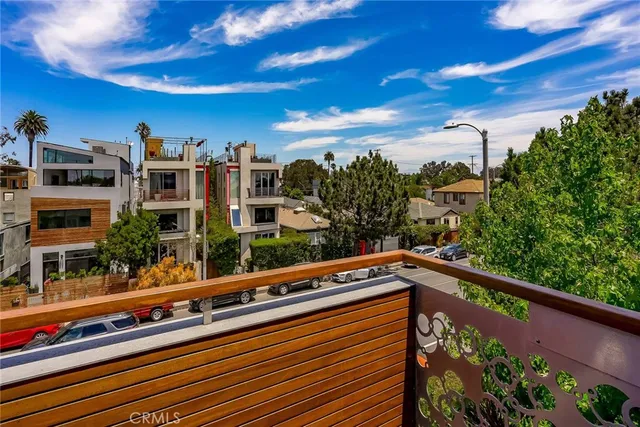 a view of balcony with two potted plants