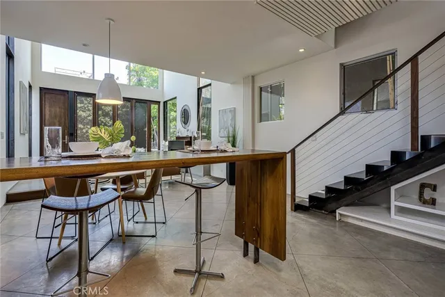 a room with lots of furniture and a chandelier