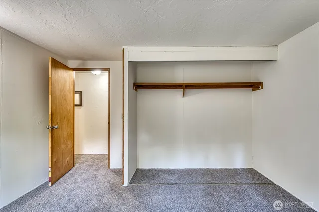 front view of a house with a tiny house and a trees