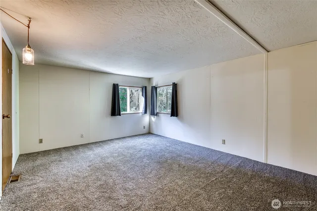 an aerial view of a houses with outdoor space