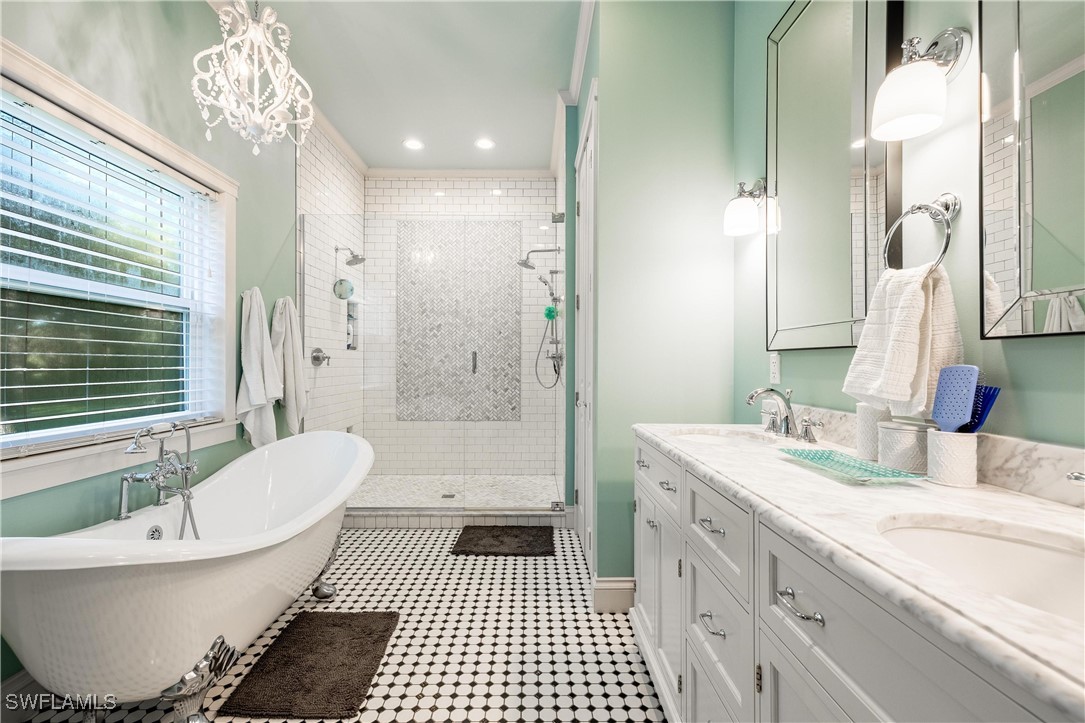 1135 Firebrand Court LaBelle, FL 33935 - Photo 23 of 45 a bathroom with a bathtub shower sink vanity and a toilet