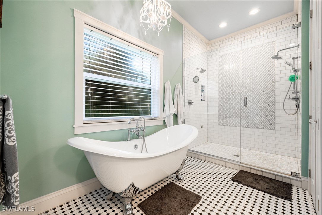 1135 Firebrand Court LaBelle, FL 33935 - Photo 24 of 45 a bathroom with a bathtub and a shower