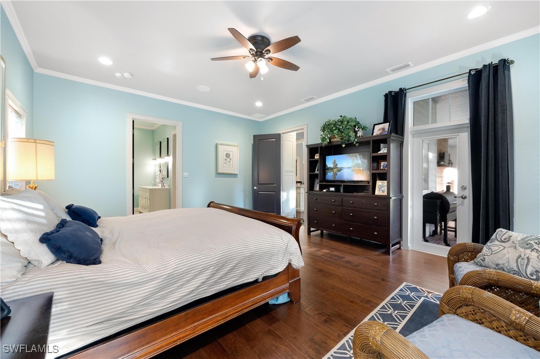 1135 Firebrand Court LaBelle, FL 33935 - Photo 25 of 45 a bedroom with a bed and ceiling fan