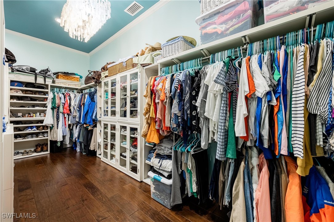 1135 Firebrand Court LaBelle, FL 33935 - Photo 27 of 45 a view of walk in closet with clothes and shoes