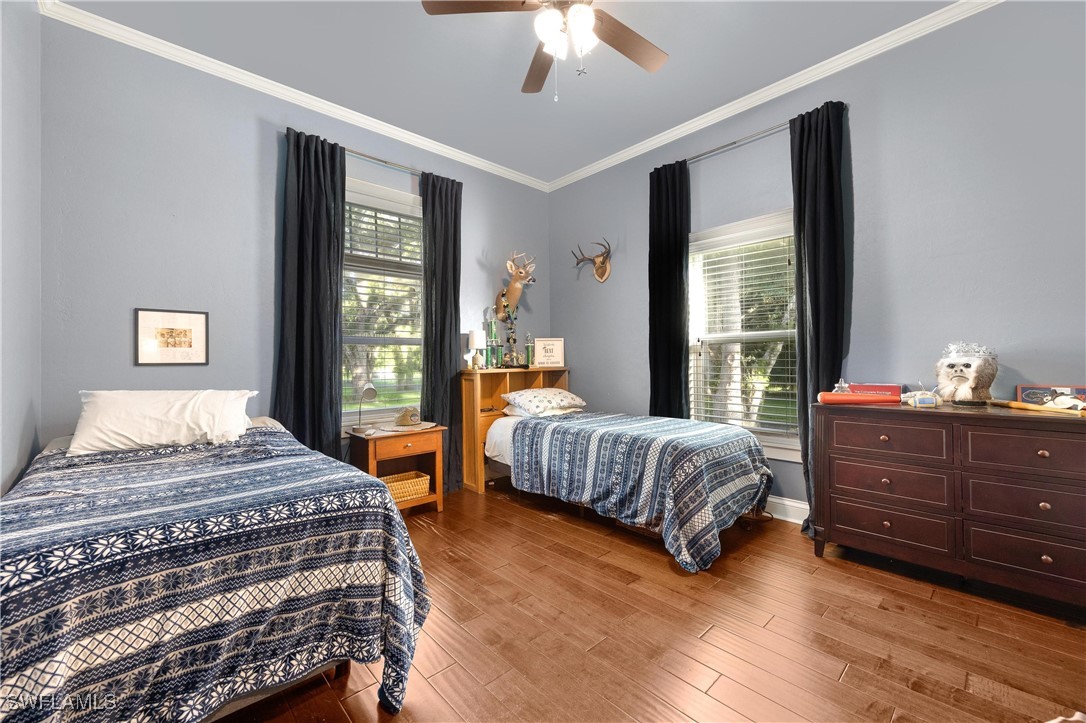 1135 Firebrand Court LaBelle, FL 33935 - Photo 30 of 45 a bedroom with a bed and window