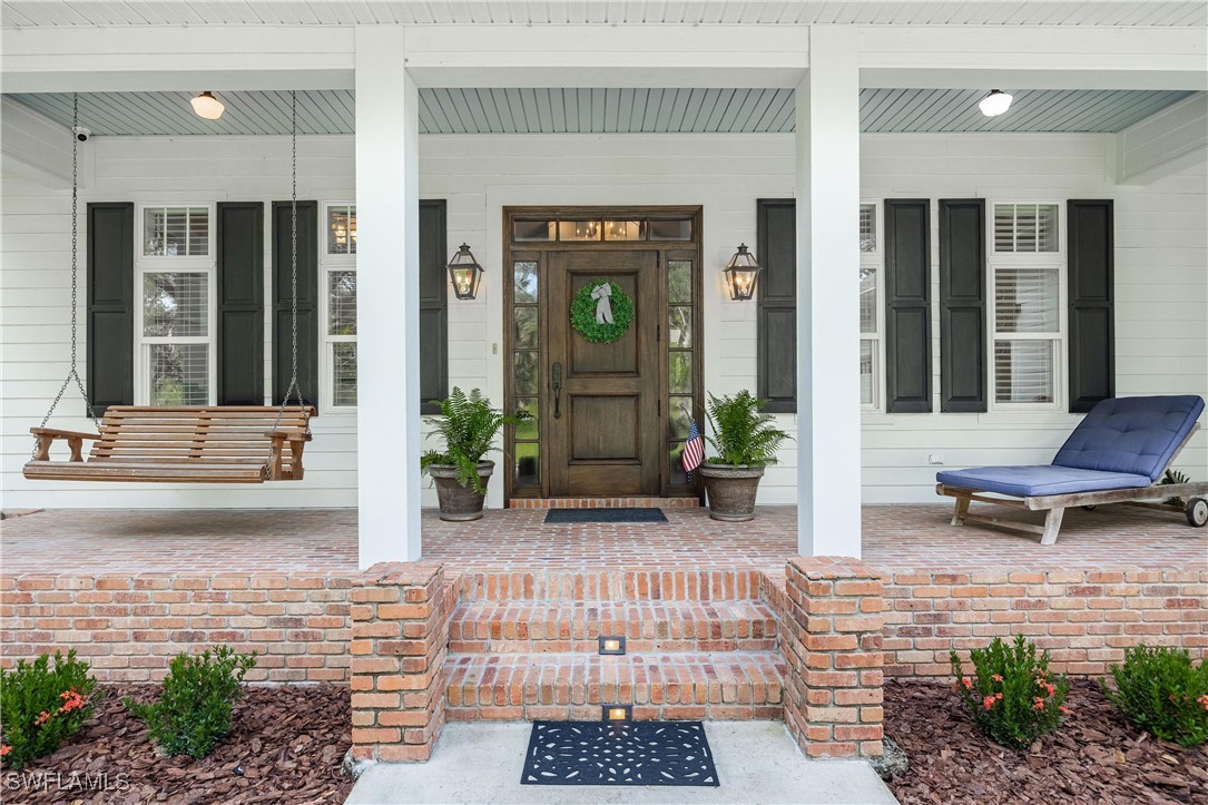 1135 Firebrand Court LaBelle, FL 33935 - Photo 3 of 45 a view of a entryway door of the house