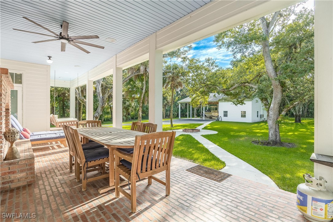 1135 Firebrand Court LaBelle, FL 33935 - Photo 32 of 45 a view of a patio with a backyard