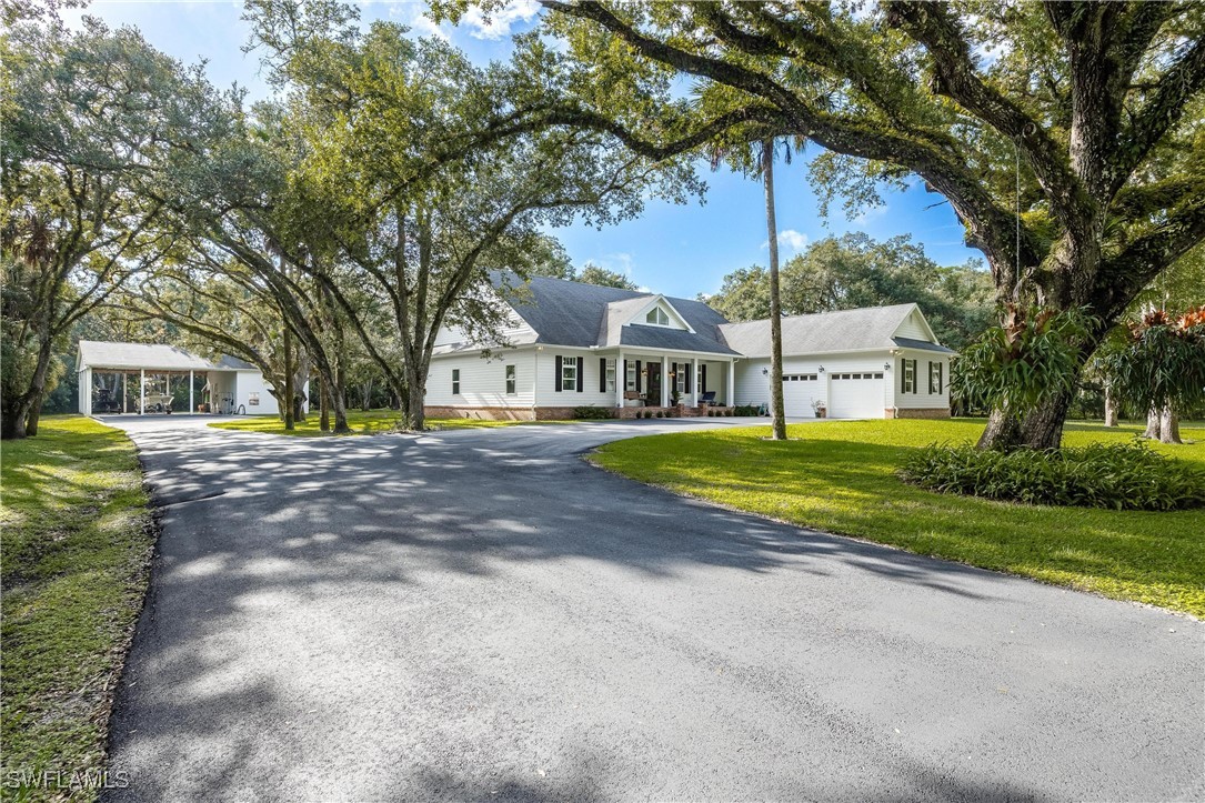 1135 Firebrand Court LaBelle, FL 33935 - Photo 5 of 45 a view of house with yard and green space