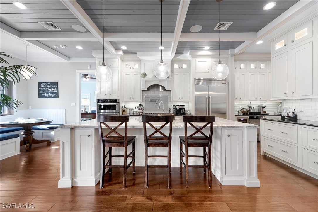 1135 Firebrand Court LaBelle, FL 33935 - Photo 7 of 45 a kitchen with cabinets table and chairs