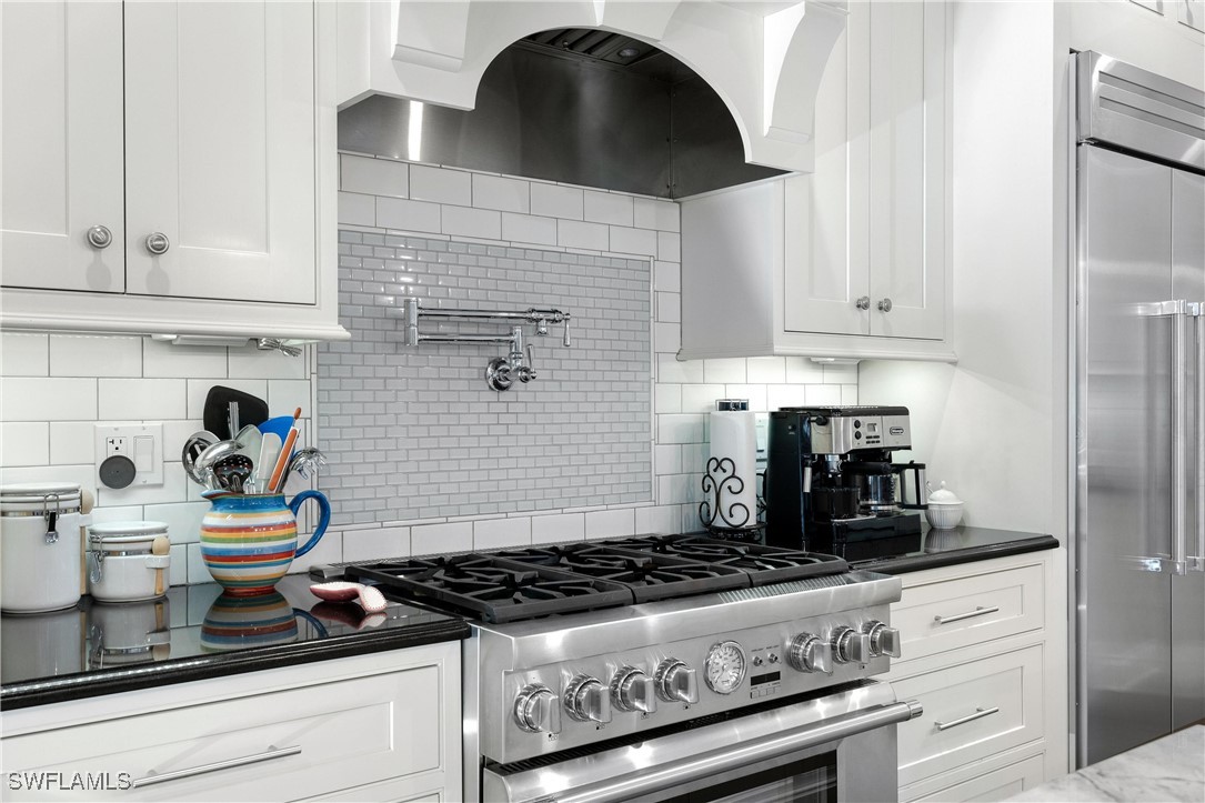 1135 Firebrand Court LaBelle, FL 33935 - Photo 8 of 45 a kitchen with a stove and cabinets