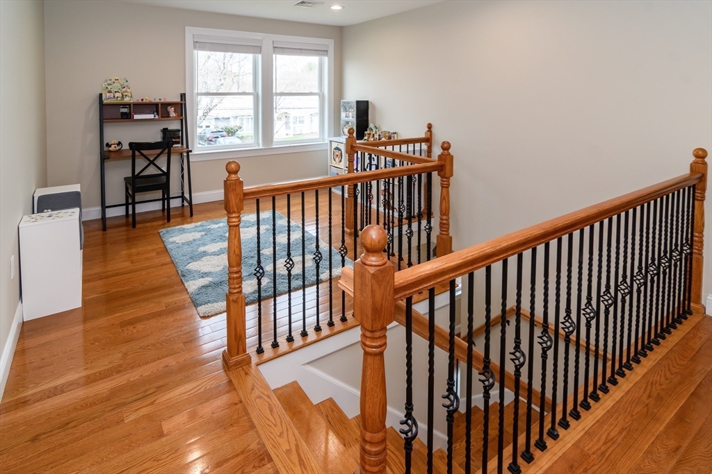 3 Leighton Street Natick, MA 01760 - Photo 14 of 31 a view of hallway with wooden floor and stairs