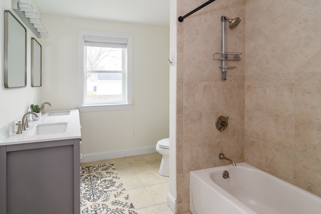 3 Leighton Street Natick, MA 01760 - Photo 15 of 31 a bathroom with a sink toilet and shower