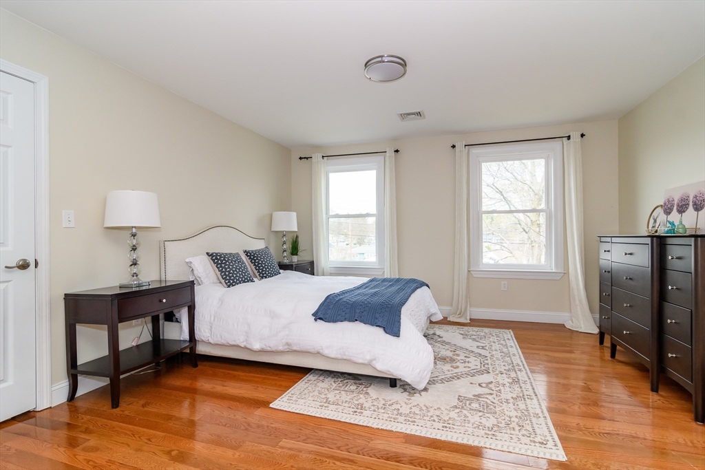 3 Leighton Street Natick, MA 01760 - Photo 16 of 31 a bedroom with a bed wooden floor and window