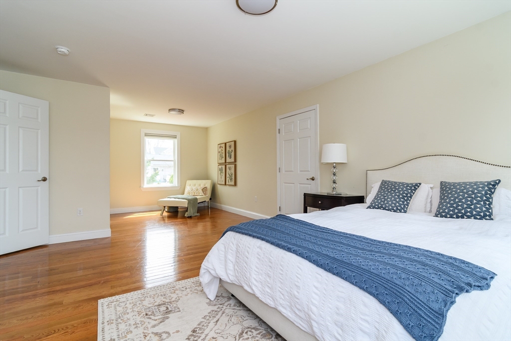 3 Leighton Street Natick, MA 01760 - Photo 17 of 31 a bedroom with a bed and wooden floor
