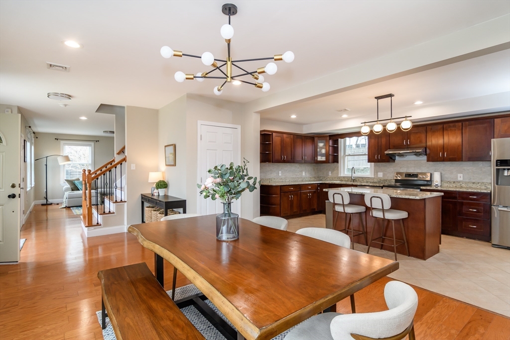 3 Leighton Street Natick, MA 01760 - Photo 2 of 31 a kitchen with stainless steel appliances granite countertop a sink a stove and chairs