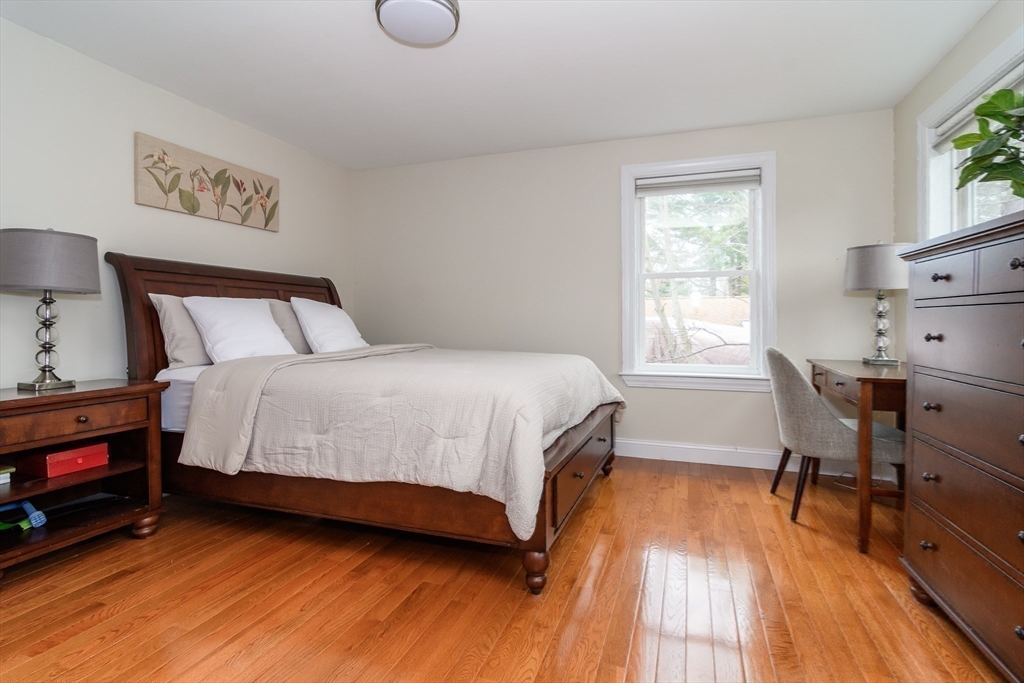 3 Leighton Street Natick, MA 01760 - Photo 22 of 31 a bedroom with a bed and a table in it