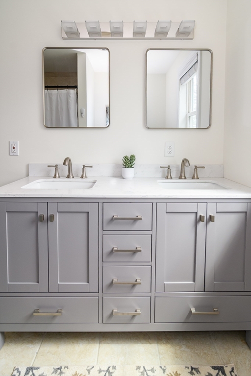 3 Leighton Street Natick, MA 01760 - Photo 23 of 31 a bathroom with a sink vanity and a mirror