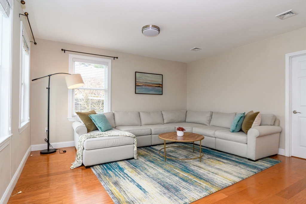 3 Leighton Street Natick, MA 01760 - Photo 9 of 31 a living room with furniture and a large window